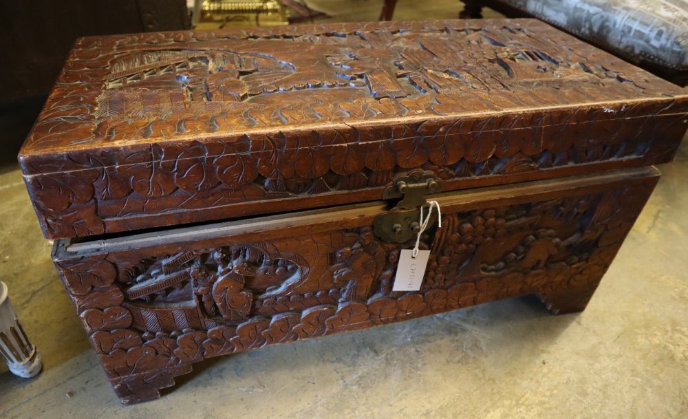 An Asian relief carved camphorwood coffer, width 73cm